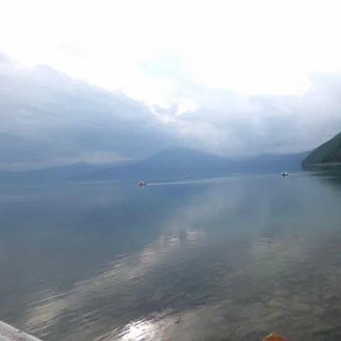 Lake Toya under low cloud with the hills behind
