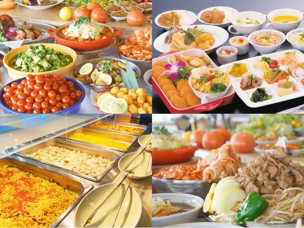Multiple dishes of local cuisine on dark table surface